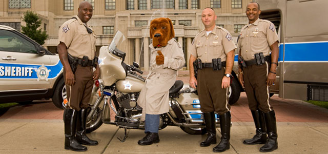 McGruff the Crime Dog with students at a Lexington school